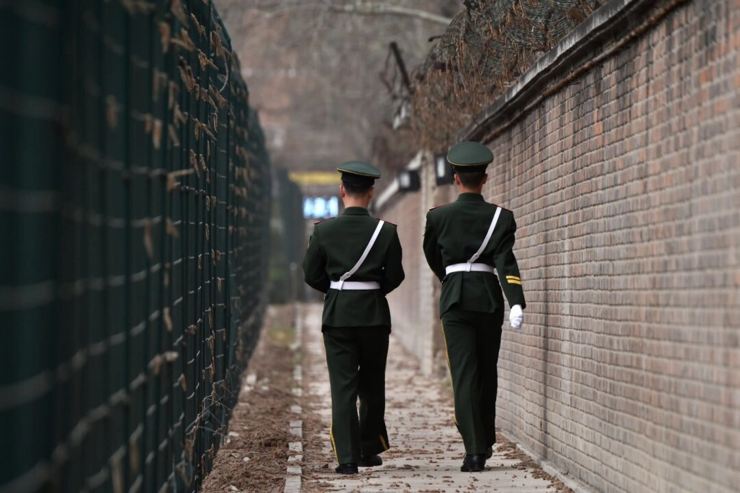 Chinese paramilitary police officers patrol in Beijing