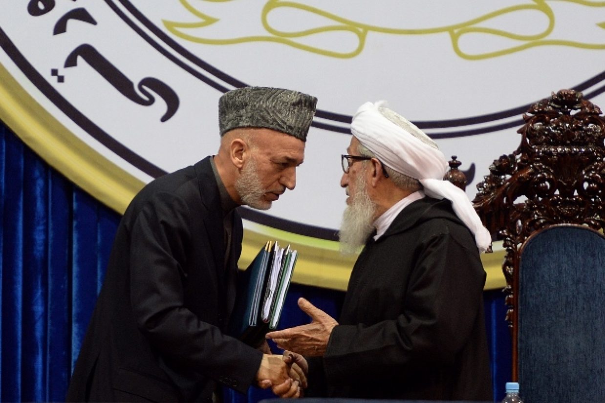 اعضای لویه جرگه مشورتی با صدور قطعنامه‌‌‏ای شامل ۳۱ ماده با امضای پیمان امنیتی میان افغانستان و آمریکا موافقت کردند. (MASSOUD HOSSAINI/AFP/Getty Images)