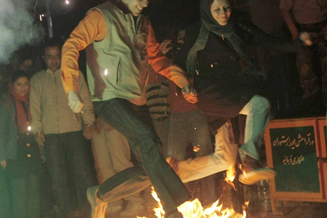 CORRECTING DATE OF PICTURE IN CAPTION
(FILES) -- File picture dated March 18, 2008 shows an Iranian couple jumping over a bonfire during the "Charshanbe Soori" or (Festival of Fire) in Darakeh mountain north of Tehran. Iran's supreme leader Ayatollah Ali Khamenei said on March 14, 2010 that Iranians should shun next week's Persian fire festival as it is un-Islamic and creates "a lot of harm." The ancient Pagan festival, is held on the eve of the last Wednesday of the Persian calendar year. This year the ritual falls on the night of March 16. AFP PHOTO/BEHROUZ MEHRI (Photo credit should read BEHROUZ MEHRI/AFP/Getty Images)