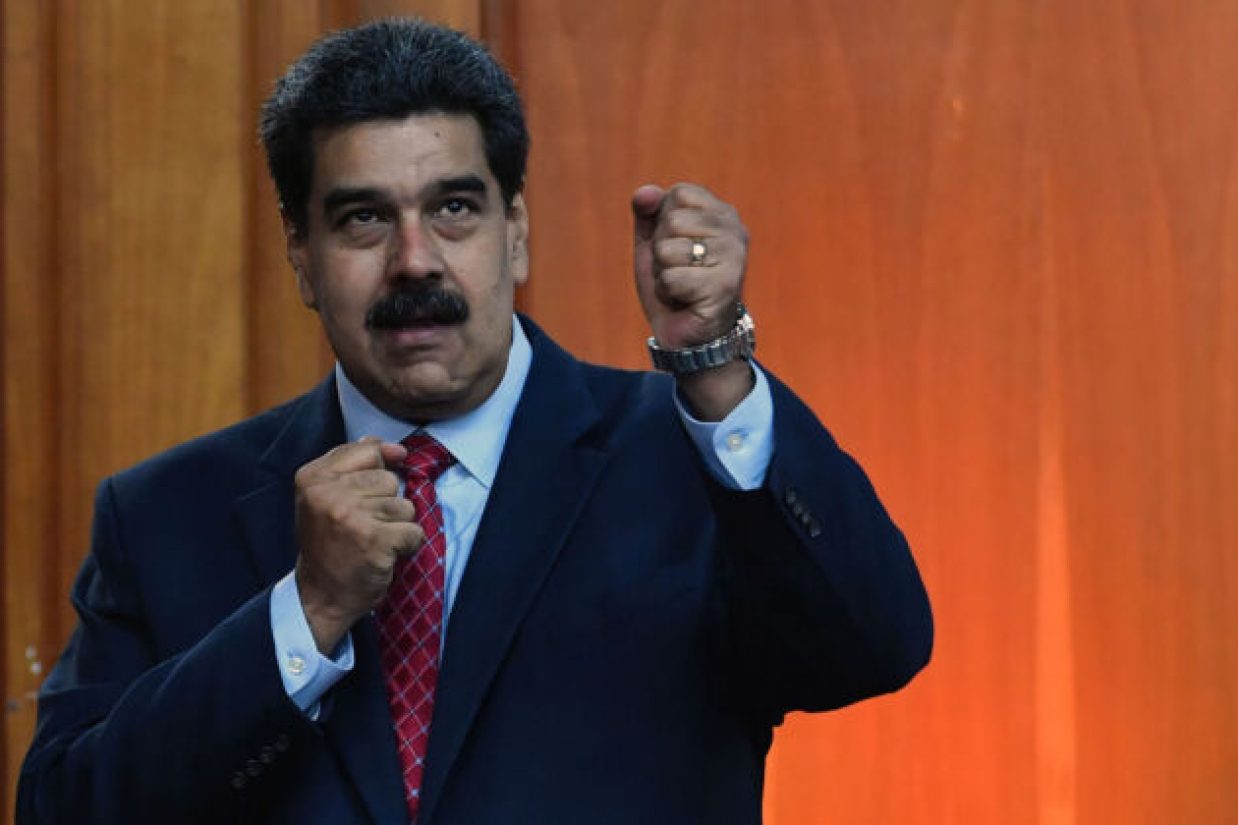 Venezuelan President Nicolas Maduro leaves after offering a press conference in Caracas, on January 25, 2019. - Venezuela's opposition leader Juan Guaido called Friday for a "major demonstration" next week to demand the resignation of President Nicolas Maduro, in his first public appearance since declaring himself "acting president" two days ago. (Photo by Yuri CORTEZ / AFP)        (Photo credit should read YURI CORTEZ/AFP/Getty Images)