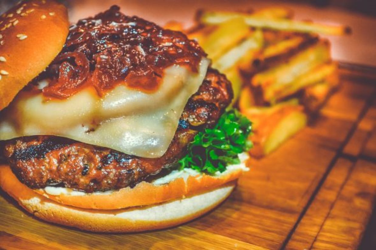 selective-focus-of-ham-burger-on-wooden-surface-photo-750075-590x393